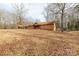 Ranch house with carport and wooded lot at 664 Freemont Dr, Lancaster, SC 29720