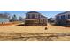 New construction backyard with immature landscaping and wooden porch at 8078 Blackwood Rd, Denver, NC 28037