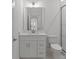 Modern bathroom featuring sleek vanity, a contemporary mirror and a glass enclosed shower at 8078 Blackwood Rd, Denver, NC 28037