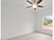 The room offers ample natural light through a window and features a contemporary ceiling fan at 8078 Blackwood Rd, Denver, NC 28037