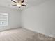 Bright bedroom features a window, neutral carpet, and ample space at 8078 Blackwood Rd, Denver, NC 28037