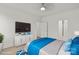 Modern bedroom with a mounted TV and beautiful decor, perfect for relaxing and unwinding at 8078 Blackwood Rd, Denver, NC 28037
