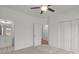 This bedroom is carpeted and features double closets, a ceiling fan and an ensuite bathroom at 8078 Blackwood Rd, Denver, NC 28037