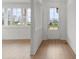 Inviting entryway features wood-look floors, white walls, and a glass-paneled front door that offers a clear view outside at 8078 Blackwood Rd, Denver, NC 28037