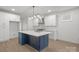 Bright kitchen with a large center island, stainless steel appliances, and stylish pendant lighting at 8078 Blackwood Rd, Denver, NC 28037