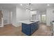 Stylish kitchen island with seating and a stainless steel dishwasher in a bright and airy space at 8078 Blackwood Rd, Denver, NC 28037