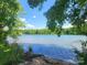 Serene lake view with lush greenery and a tranquil waterfront at 8078 Blackwood Rd, Denver, NC 28037