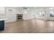 Cozy living room is highlighted by a stone fireplace and a large, open floor plan at 8078 Blackwood Rd, Denver, NC 28037