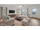 Bright living room with hardwood floors and many windows at 8078 Blackwood Rd, Denver, NC 28037