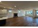 Spacious living room boasting hardwood floors, recessed lighting and a stone fireplace at 8078 Blackwood Rd, Denver, NC 28037