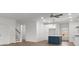 Bright and airy living space features a kitchen island, hardwood floors and a staircase at 8078 Blackwood Rd, Denver, NC 28037