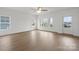 Bright living room with wood flooring, large windows, and natural light at 8078 Blackwood Rd, Denver, NC 28037