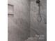 Tiled shower with a rain shower head and built-in shelves at 8078 Blackwood Rd, Denver, NC 28037