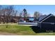 Lush front yard with white fence and lake view at 8078 Blackwood Rd, Denver, NC 28037