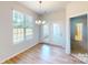 Bright dining area with hardwood floors and chandelier at 8101 Jacey Ln # 38, Huntersville, NC 28078