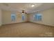 Spacious secondary bedroom with neutral carpeting and large windows at 9730 Tufts Dr, Mint Hill, NC 28227