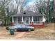 Charming red brick cottage with screened porch and mature trees at 1 Catawba Ave, Great Falls, SC 29055