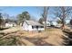 Aerial view of a small white house with a porch and surrounding houses at 1024 Chester Ave, Great Falls, SC 29055