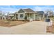 Green house with driveway and landscaping in the front yard at 1052 33Rd Avenue Ne Loop, Hickory, NC 28601