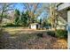 Large backyard with shed and mature trees at 109 Belton Ave, Mount Holly, NC 28120