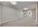 Spacious basement with gray walls and carpeted floors at 109 Belton Ave, Mount Holly, NC 28120