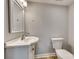 Simple bathroom with white vanity and toilet at 109 Belton Ave, Mount Holly, NC 28120