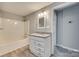 Clean bathroom with white vanity, granite countertop, and tub at 109 Belton Ave, Mount Holly, NC 28120