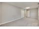 Simple bedroom with gray walls, carpet, and double door closet at 109 Belton Ave, Mount Holly, NC 28120