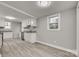 Eat-in kitchen with white cabinets and granite countertops at 109 Belton Ave, Mount Holly, NC 28120