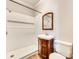 Updated bathroom with a vanity and a shower featuring white tiling and a modern shower head at 122 Quinn Ave, Gastonia, NC 28054
