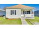 Charming single-story home featuring a cozy front porch and well-maintained lawn at 122 Quinn Ave, Gastonia, NC 28054