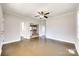 Bright living room featuring dark hardwood floors and a ceiling fan at 122 Quinn Ave, Gastonia, NC 28054