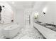 Luxurious bathroom with marble floors and a soaking tub at 130 Cherokee Rd # 304, Charlotte, NC 28207