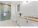 Clean bathroom with light wood vanity and walk-in shower at 130 Cherokee Rd # 304, Charlotte, NC 28207