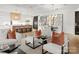 Bright dining area with modern chandelier and hardwood floors at 130 Cherokee Rd # 304, Charlotte, NC 28207