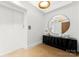 Bright entryway, featuring a large mirror and contemporary console at 130 Cherokee Rd # 304, Charlotte, NC 28207