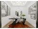 Modern home office with a unique desk and large-scale artwork at 130 Cherokee Rd # 304, Charlotte, NC 28207