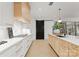 Modern kitchen with marble countertops and stainless steel appliances at 130 Cherokee Rd # 304, Charlotte, NC 28207