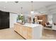 Large kitchen island with white countertop and wooden base at 130 Cherokee Rd # 304, Charlotte, NC 28207