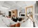 Spacious living room featuring white sofas and a modern fireplace at 130 Cherokee Rd # 304, Charlotte, NC 28207