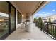 Spacious outdoor patio with built-in grill, seating area, and city views at 130 Cherokee Rd # 304, Charlotte, NC 28207