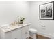 Stylish powder room with marble vanity and gold fixtures at 130 Cherokee Rd # 304, Charlotte, NC 28207