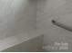 Shower with marble tile and built-in seat at 1330 Millview Ln, Matthews, NC 28104