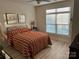 Bedroom with striped bedding and large window at 1330 Millview Ln, Matthews, NC 28104