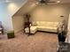 Bright bonus room features a comfortable sectional sofa and ample natural light at 1330 Millview Ln, Matthews, NC 28104