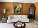 Living room with beige sofa and antique furniture at 1330 Millview Ln, Matthews, NC 28104
