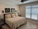 Spacious bedroom with king-size bed and window blinds at 1330 Millview Ln, Matthews, NC 28104