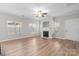 Living room with fireplace and hardwood floors at 15430 Jade St, Charlotte, NC 28277