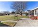 Yard with large tree and patio area at 1645 Nottingham Dr, Gastonia, NC 28054