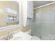 Clean bathroom featuring a shower and built-in shelving at 1645 Nottingham Dr, Gastonia, NC 28054